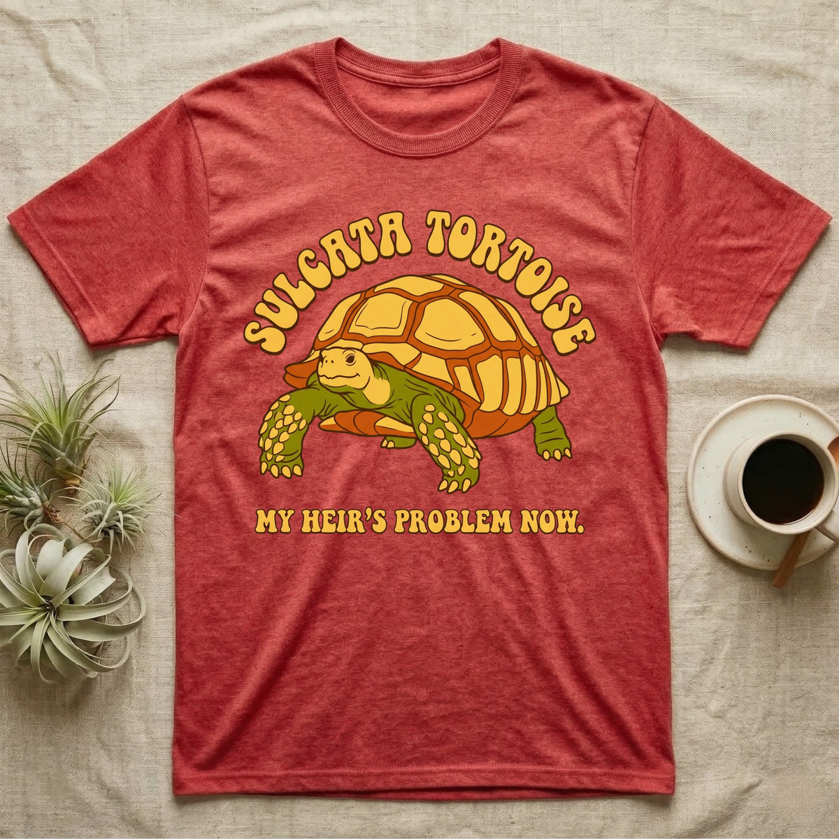 Red t-shirt with "SULGATA TORTOISE MY HEIR'S PROBLEM NOW" and cartoon tortoise graphic.