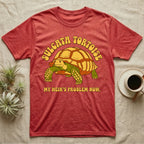 Red t-shirt with "SULGATA TORTOISE MY HEIR'S PROBLEM NOW" and cartoon tortoise graphic.