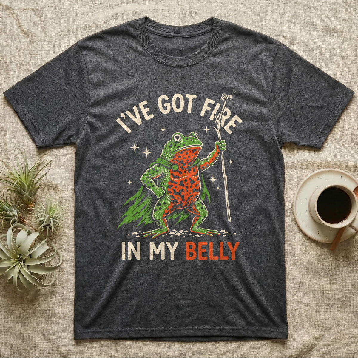 Fire-Bellied Toad Knight T-Shirt in Dark Heather — Fire-bellied toad knight with green cape, orange belly and a cricket on a twig spear, lettered I'VE GOT FIRE IN MY BELLY