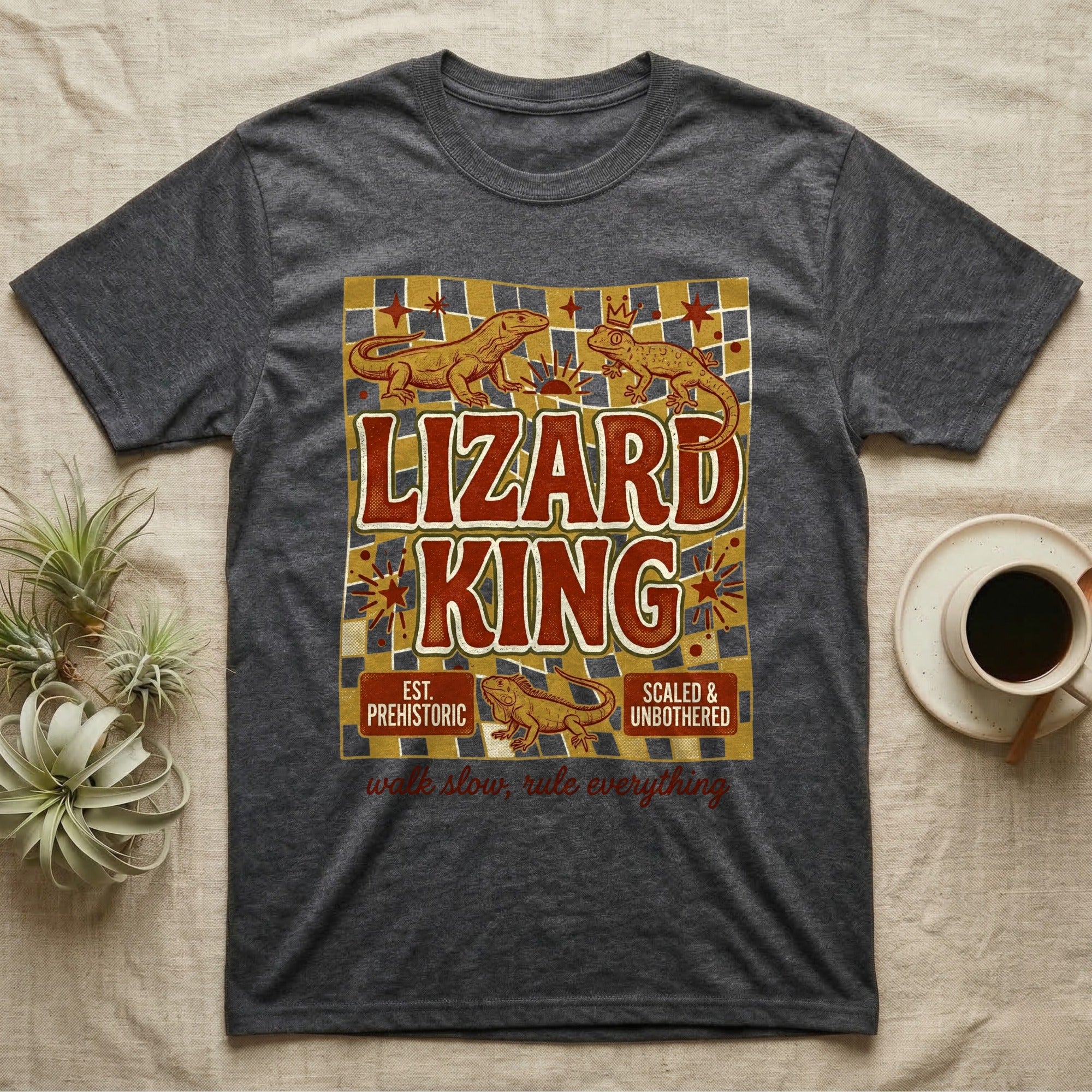 Dark gray t-shirt with "Lizard King" text, prehistoric lizards, and crown graphics.
