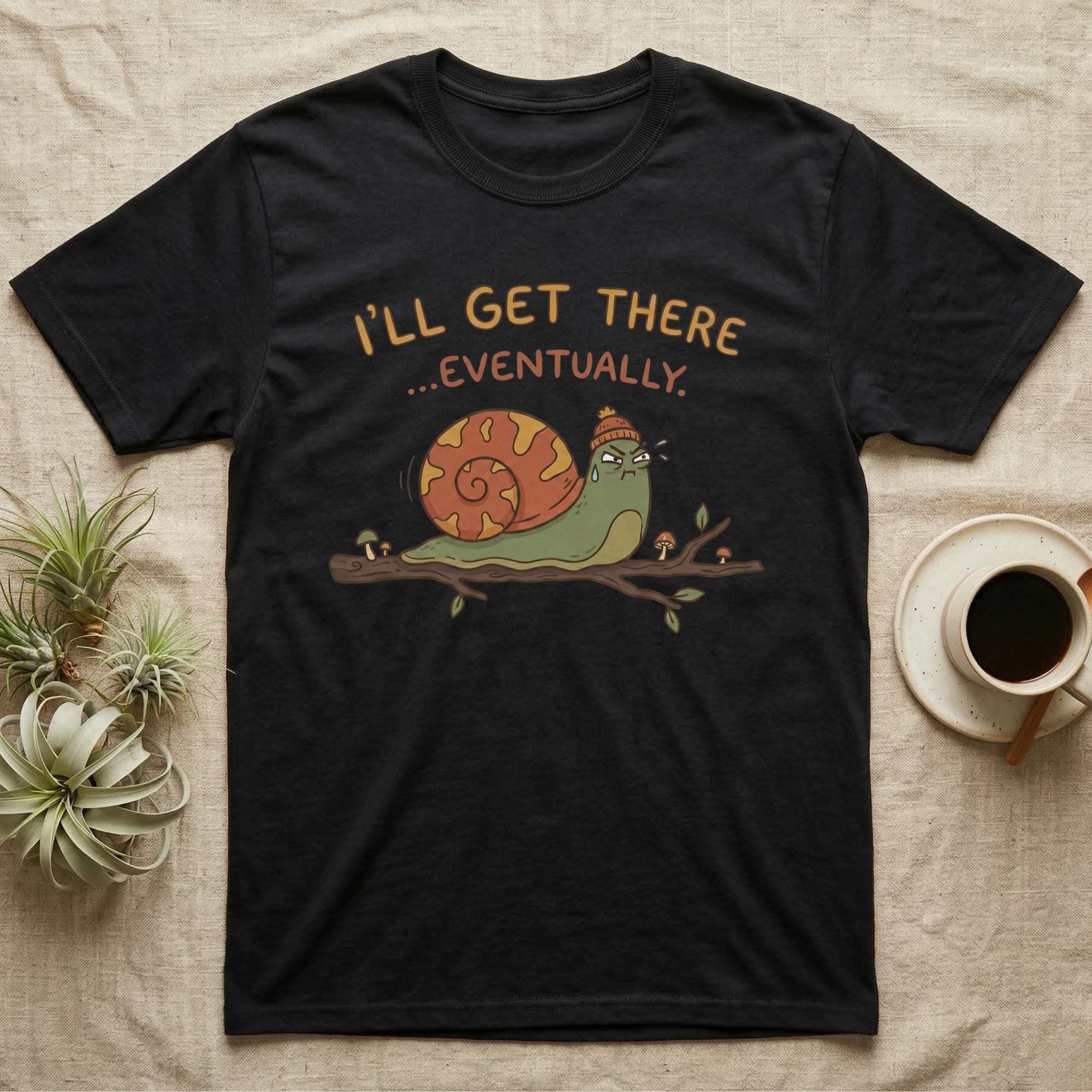Black t-shirt with snail graphic saying "I'll Get There... Eventually."