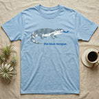 Light blue t-shirt with a grey and blue patterned lizard and text "the blue-tongue."