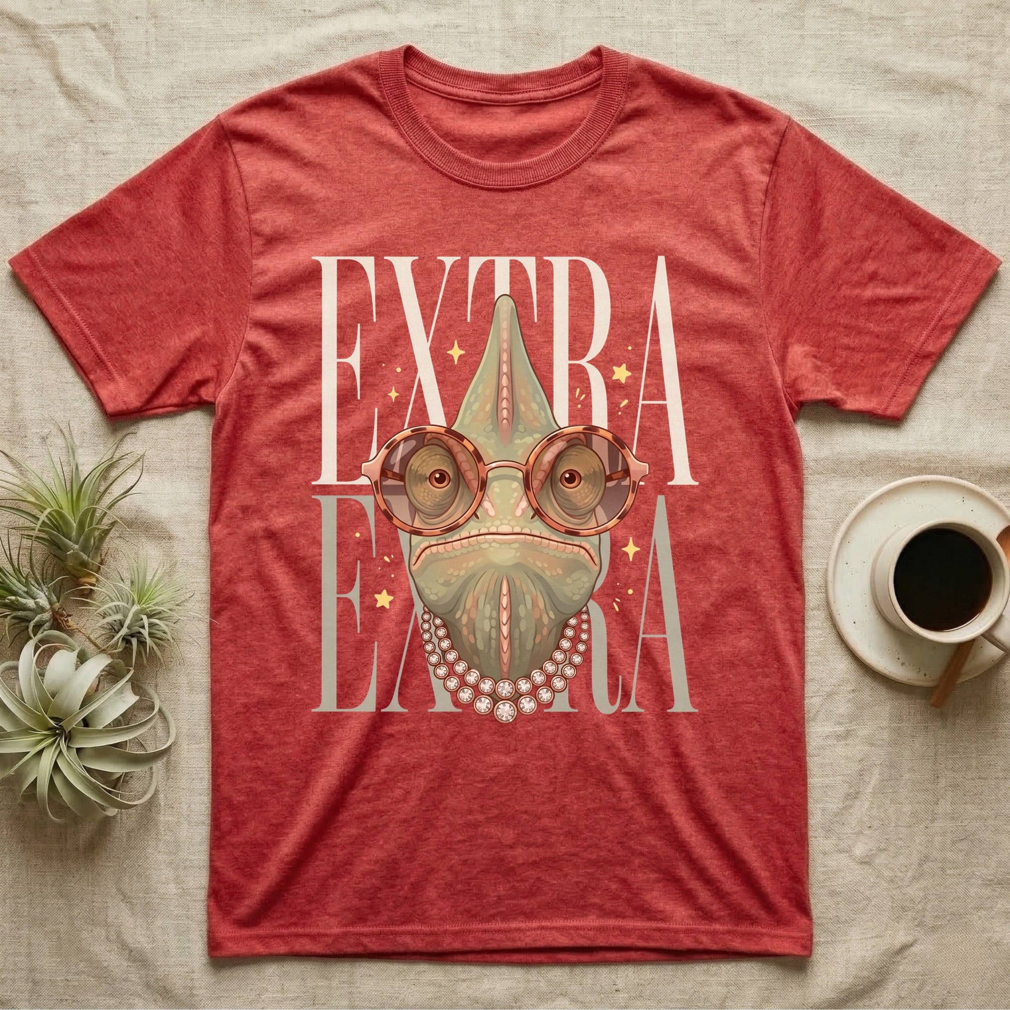 Chameleon wearing glasses and pearls on a red heathered t-shirt.