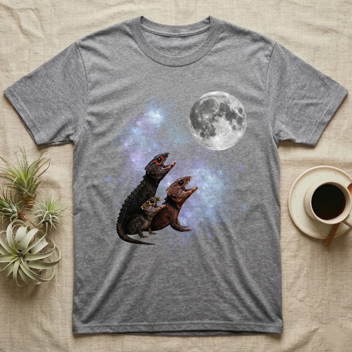Red-Eyed Crocodile Skink Moon Howl T-Shirt in Sport Grey — Three Red-Eyed Crocodile Skink colour morphs howling at a full moon over a nebula on a dark grey t-shirt.