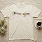 Regal Jumping Spider Canopy Crew T-Shirt in Natural — Watercolor illustration of seven regal jumping spiders in colour morphs on a branch, dark grey T-shirt design.