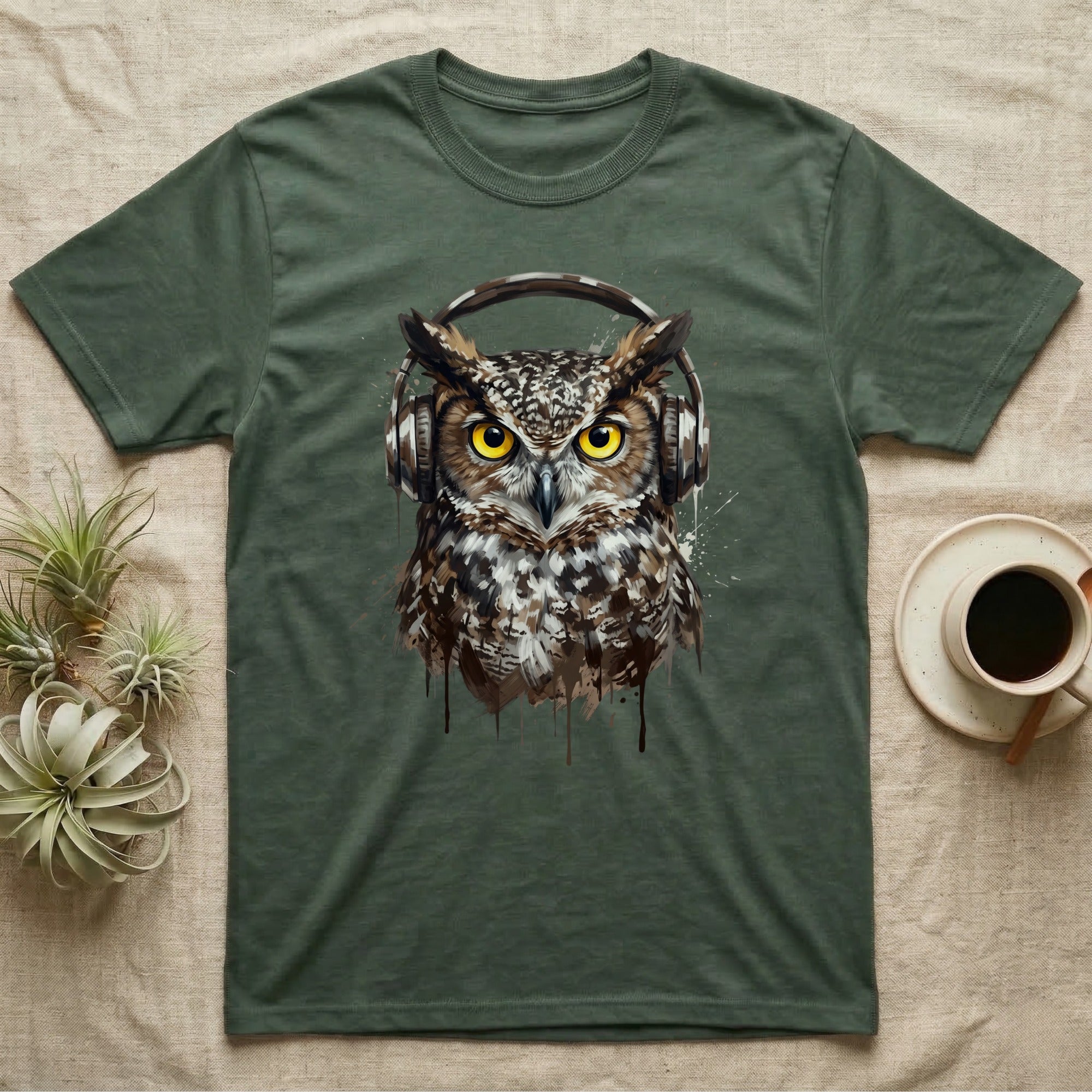 Green t-shirt with a watercolor-style owl wearing headphones.