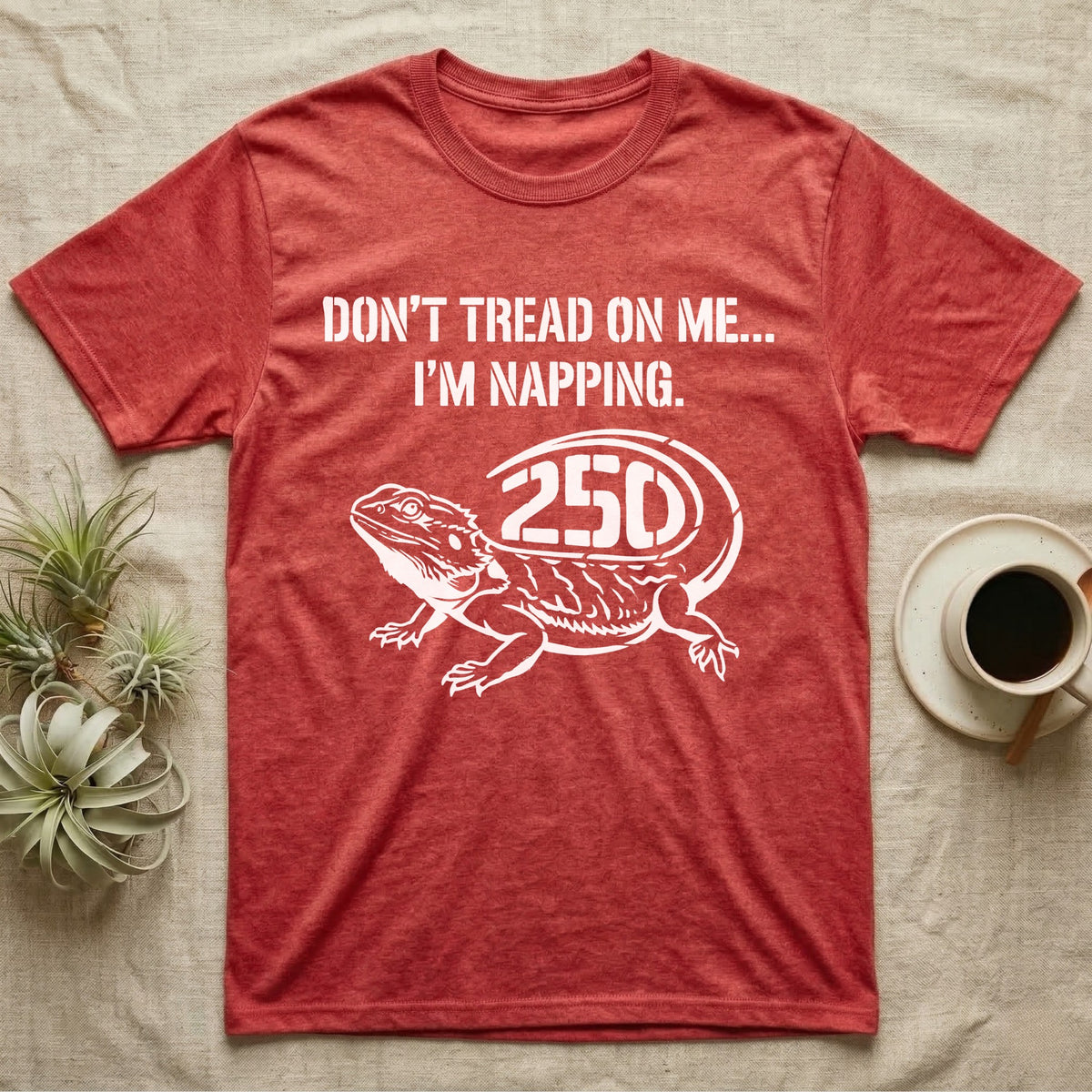 Bearded Dragon Napping T-Shirt in Heather Red — White stencil bearded dragon resting with 250 cut into the tail under text Don't Tread On Me, I'm Napping.