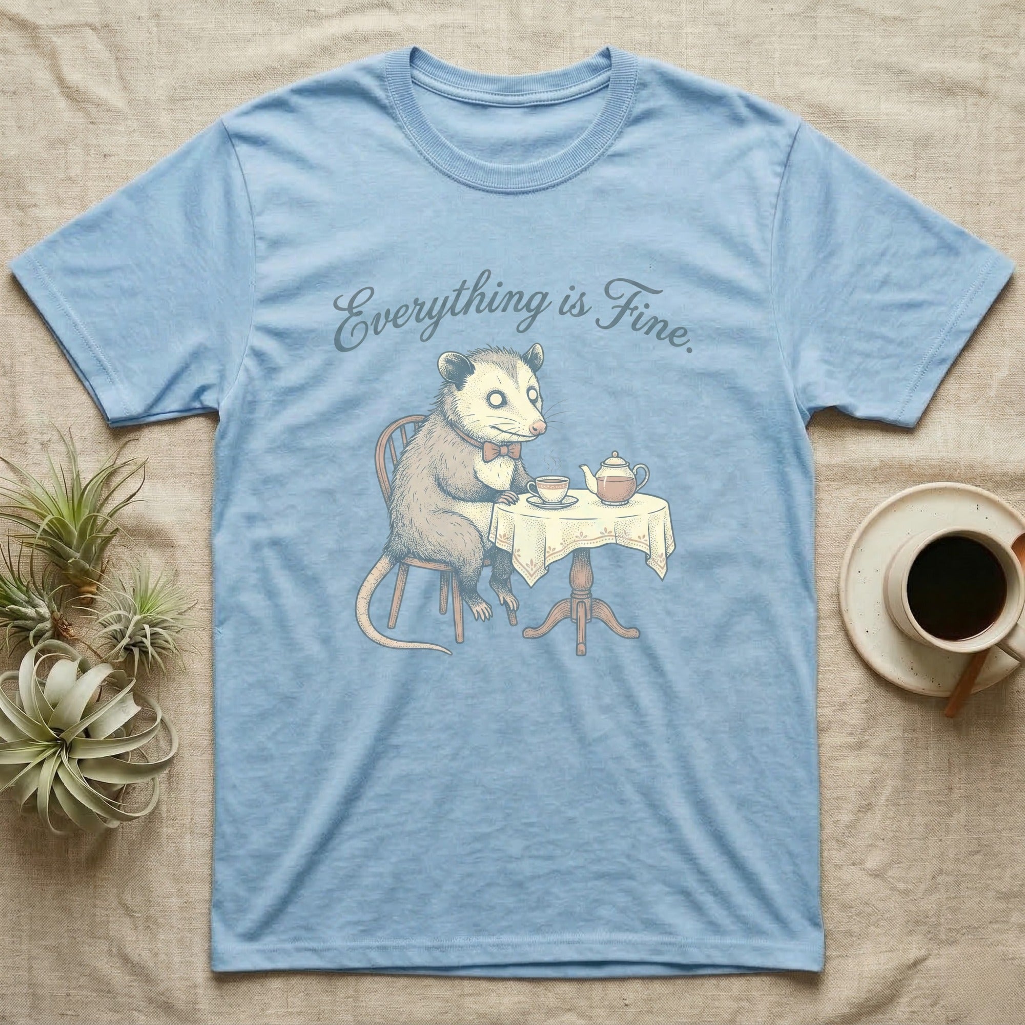 Opossum sitting at a table with tea, text "Everything is Fine."