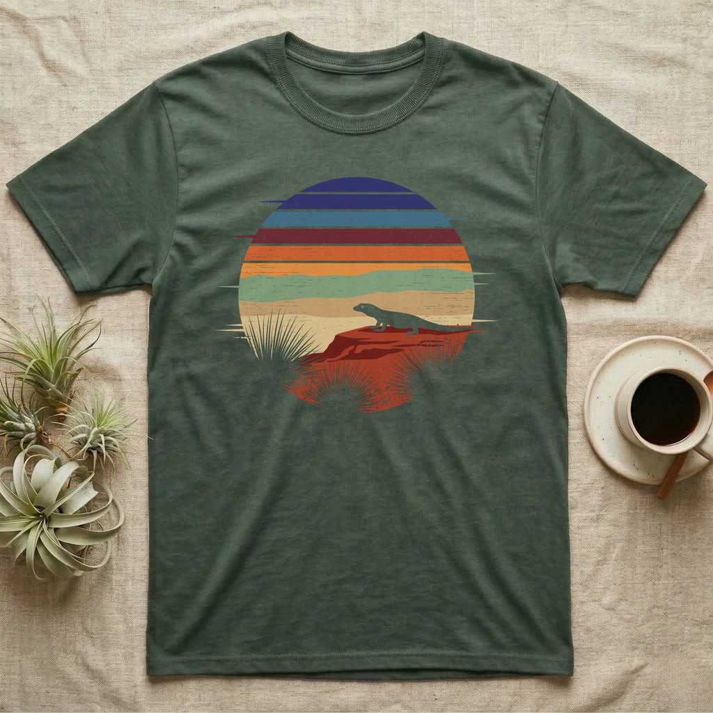 Ackie Monitor Night Window T-Shirt in Military Green — Ackie monitor silhouetted on red rock inside a broken circular window of flat stepped desert night colour bands.