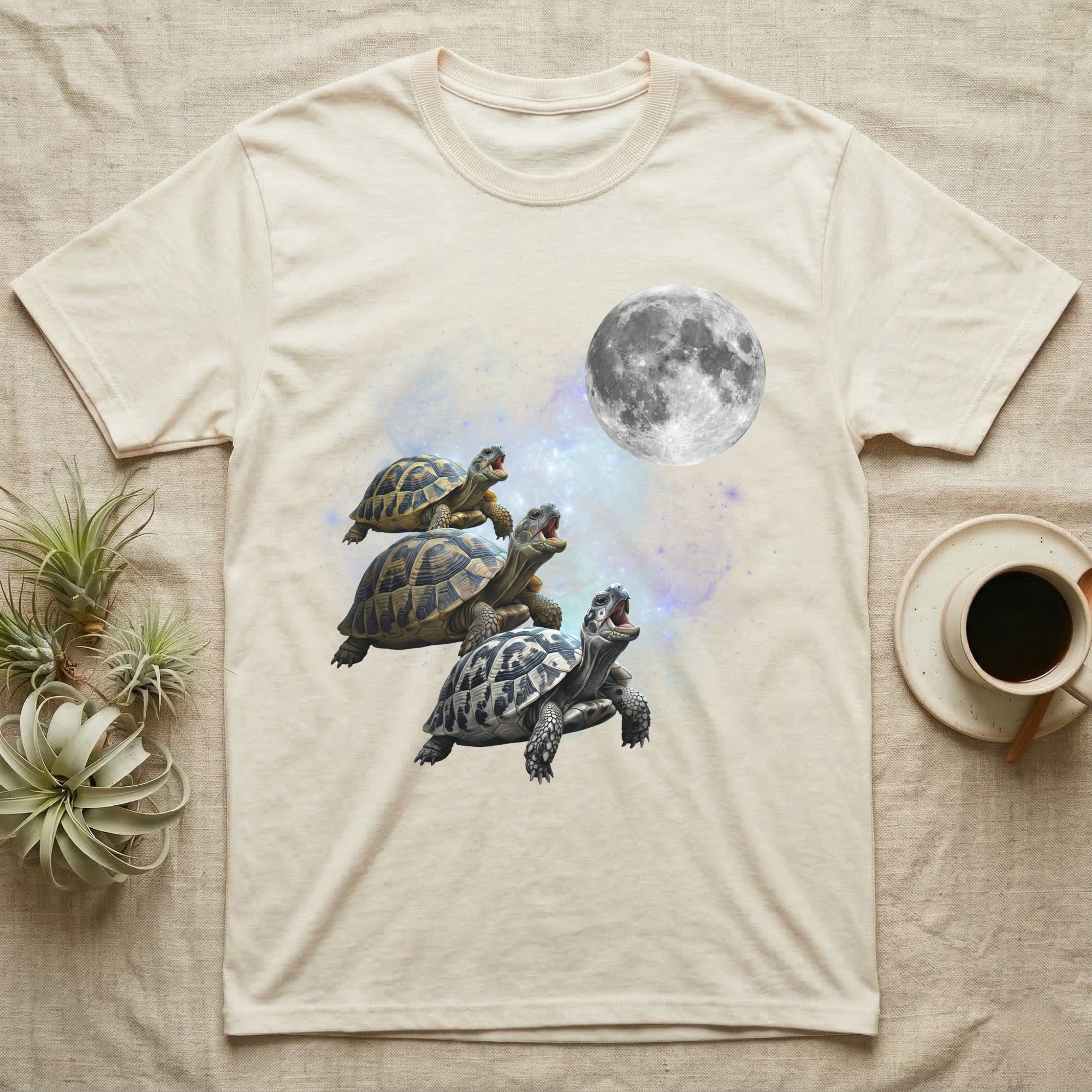 Hermann's Tortoise Moon Howl T-Shirt in Natural — Three Hermann's Tortoise colour morphs howling at a full moon over a nebula on a dark grey t-shirt.