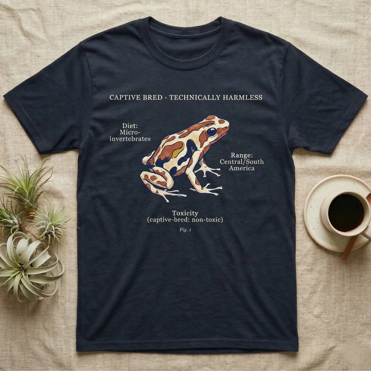 Captive Bred Dart Frog T-Shirt in Navy — Retro science-plate illustration of a labeled dart frog with field-guide callouts and a captive-bred non-toxic note.