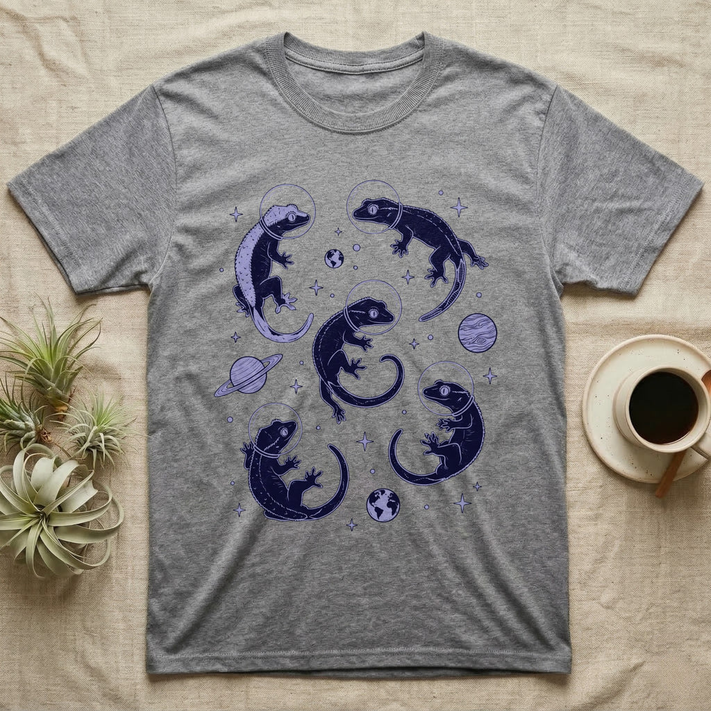 Crested Gecko Cosmic T-Shirt in Sport Grey — Vintage screen-print illustration of crested geckos in astronaut helmets floating in space, deep cosmic indigo monochromatic on dark background.