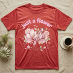 Orchid Mantis Softie T-Shirt in Heather Red — Pink orchid mantis mimicking a flower under pastel bubble text "just a flower" with tiny hearts.