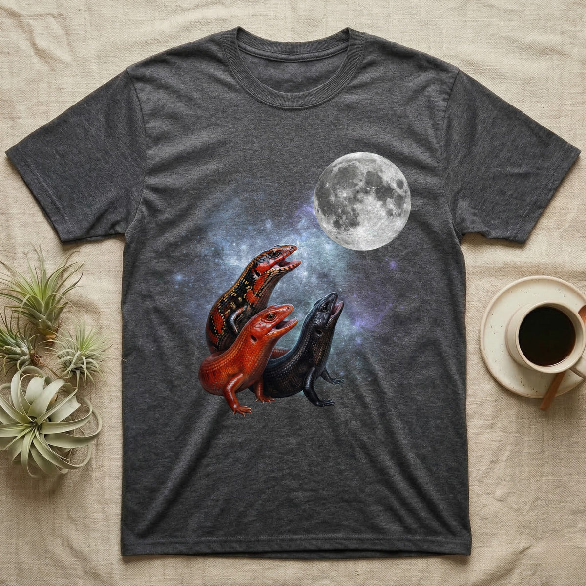 Fire Skink Moon Howl T-Shirt in Dark Heather — Three Fire Skink colour morphs howling at a full moon over a nebula on a dark grey t-shirt.