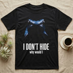 Deadpan macro mugshot of a cobalt-blue poison dart frog on black, captioned I don't hide, why would I. — shown on a Black tee.