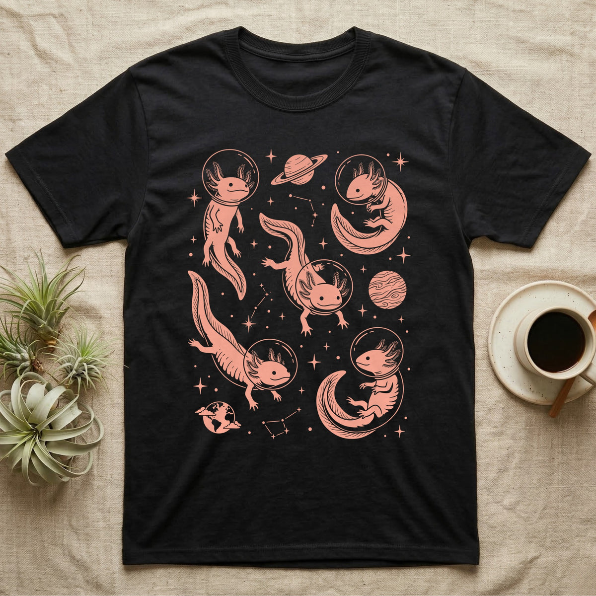 Axolotl Cosmic T-Shirt in Black — Vintage screen-print illustration of axolotls in astronaut helmets floating in space, soft coral monochromatic on dark background.