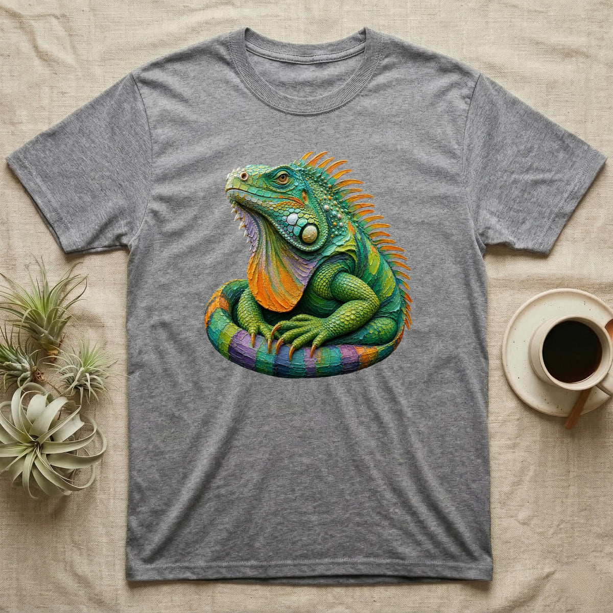 Gray t-shirt featuring a vibrant, coiled green iguana illustration.