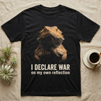 Photographic mugshot of a bearded dragon with beard flared dark above the hook I Declare War, on my own reflection. — shown on a Black tee.