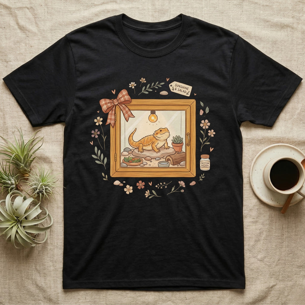 Black t-shirt with bearded dragon enclosure graphic and coffee.