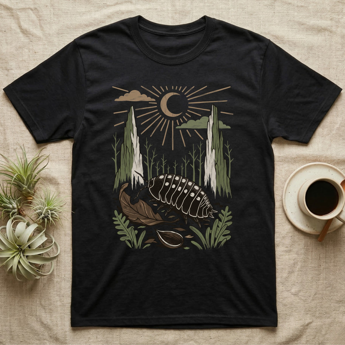 Cubaris Isopod Home Range T-Shirt in Black — Woodcut-style illustration of a Cubaris isopod walking across leaf litter with cypress knees and saplings behind, no on-shirt text.