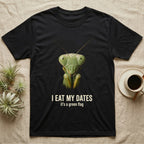 Deadpan macro mugshot of a green praying mantis on black, captioned I eat my dates, it's a green flag. — shown on a Black tee.