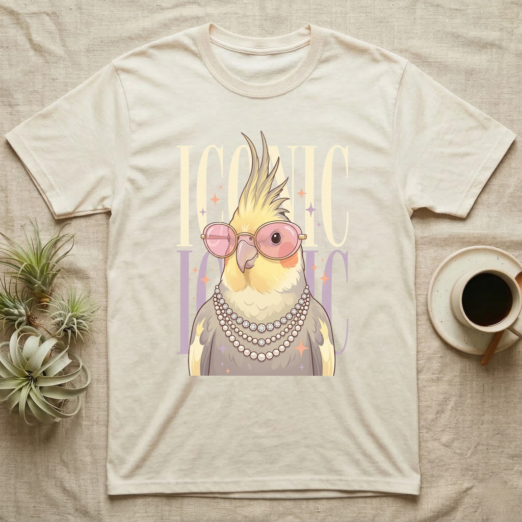 Cream t-shirt with a cockatiel wearing sunglasses and pearls.