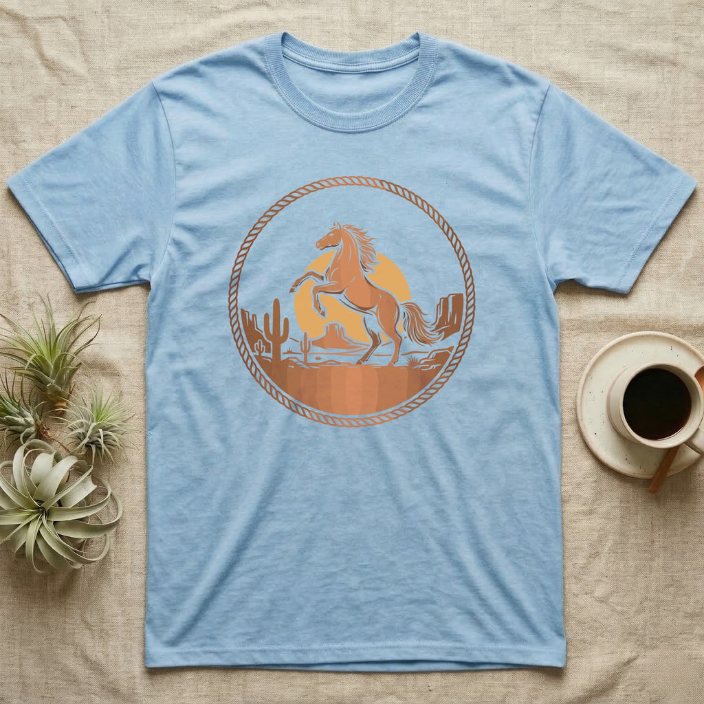 Light blue t-shirt with a circular desert scene graphic featuring a horse.