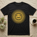 Hermann's Tortoise Sunburst T-Shirt in Black — Horn-yellow woodblock Hermann's tortoise seen head-on, its shell scutes radiating outward into a sunburst medallion.