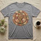Grey t-shirt with a coiled snake design made of patchwork fabric.
