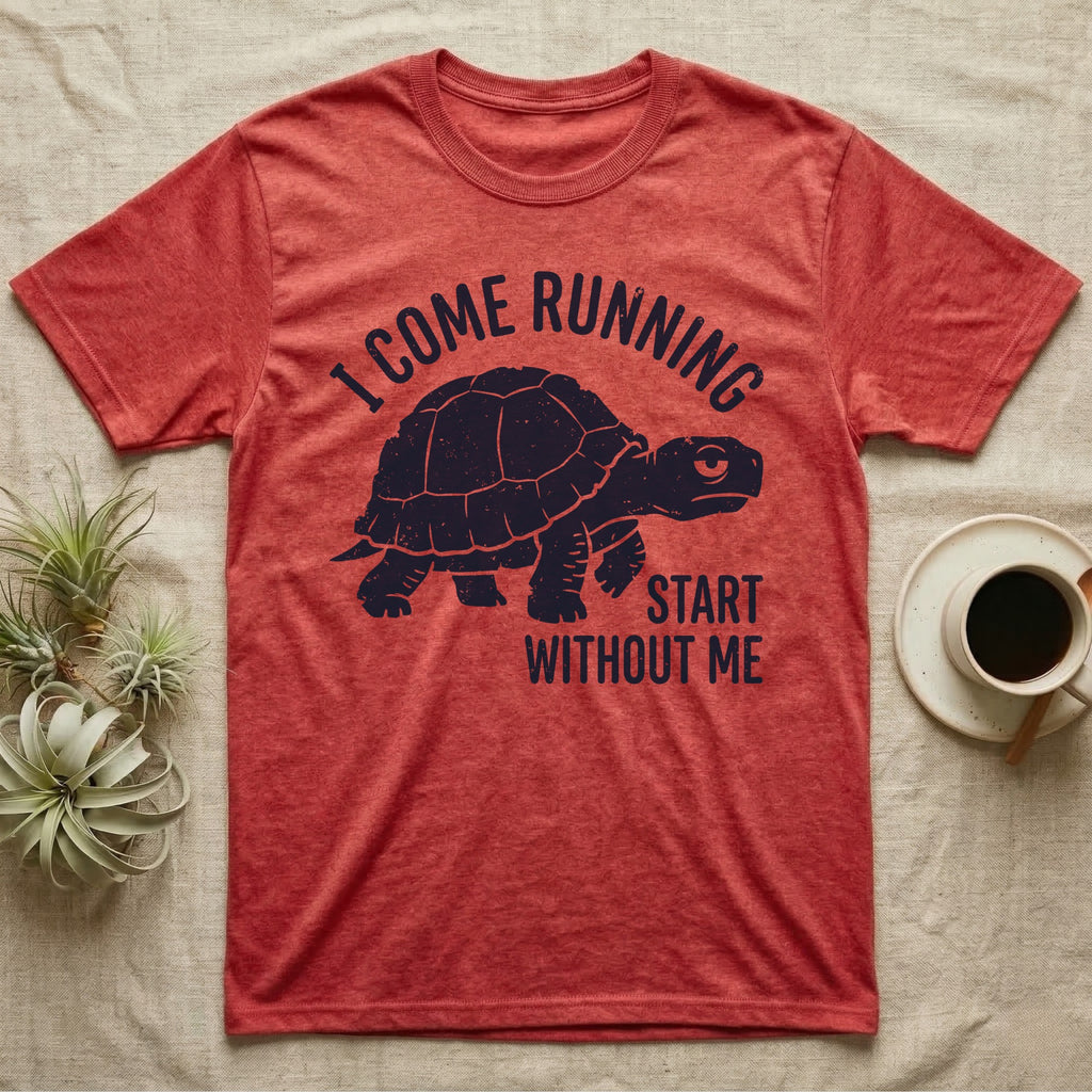 Red-Foot Tortoise Running T-Shirt in Heather Red — Navy silhouette of a red-footed tortoise walking under arched words I Come Running, beside Start Without Me