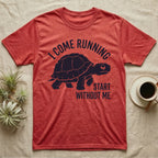 Red-Foot Tortoise Running T-Shirt in Heather Red — Navy silhouette of a red-footed tortoise walking under arched words I Come Running, beside Start Without Me