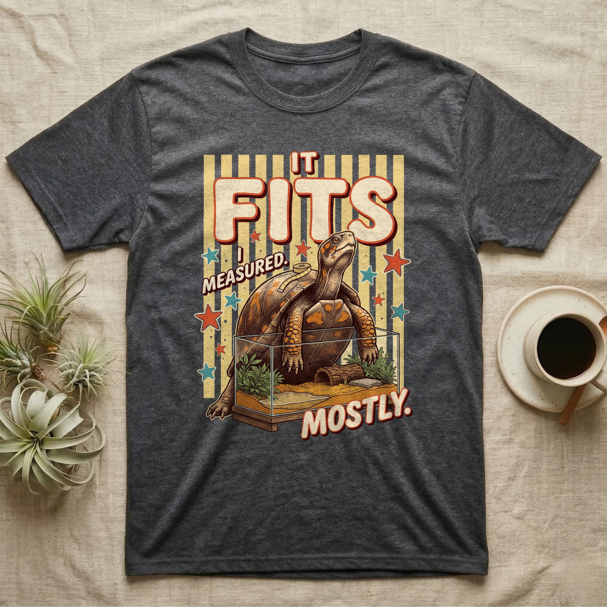 Box Turtle Enclosure Upgrade T-Shirt in Dark Heather — Engraved box turtle sitting beside a huge planted glass terrarium under fat IT FITS club lettering.