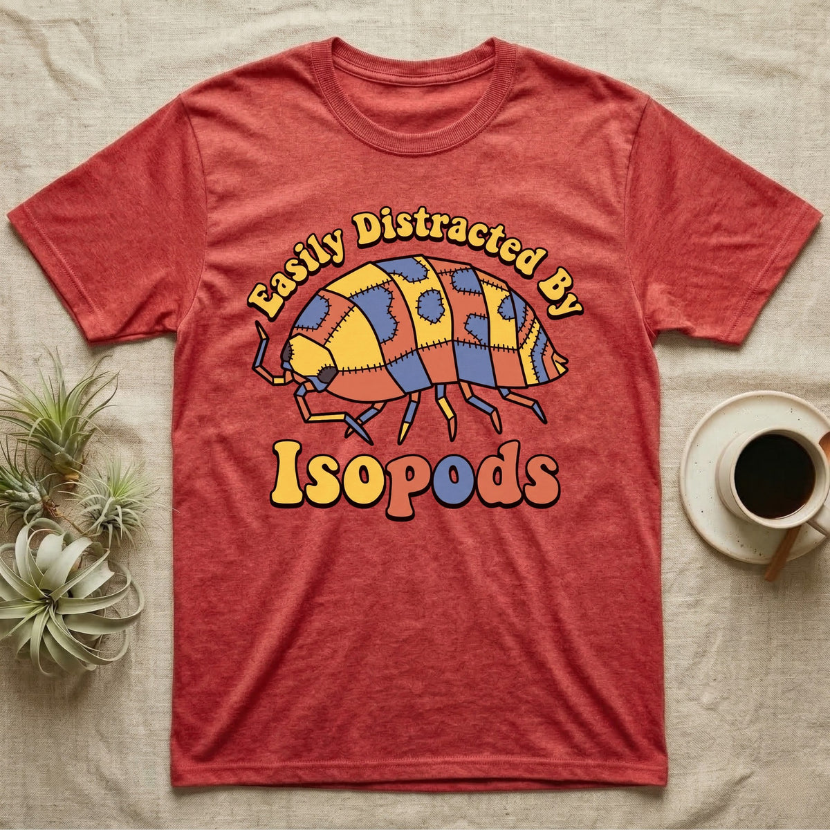 Dairy Cow Isopod Patchwork T-Shirt in Heather Red — Quilt-patchwork dairy cow isopod in mustard and denim under retro "Easily Distracted By Isopods" text.