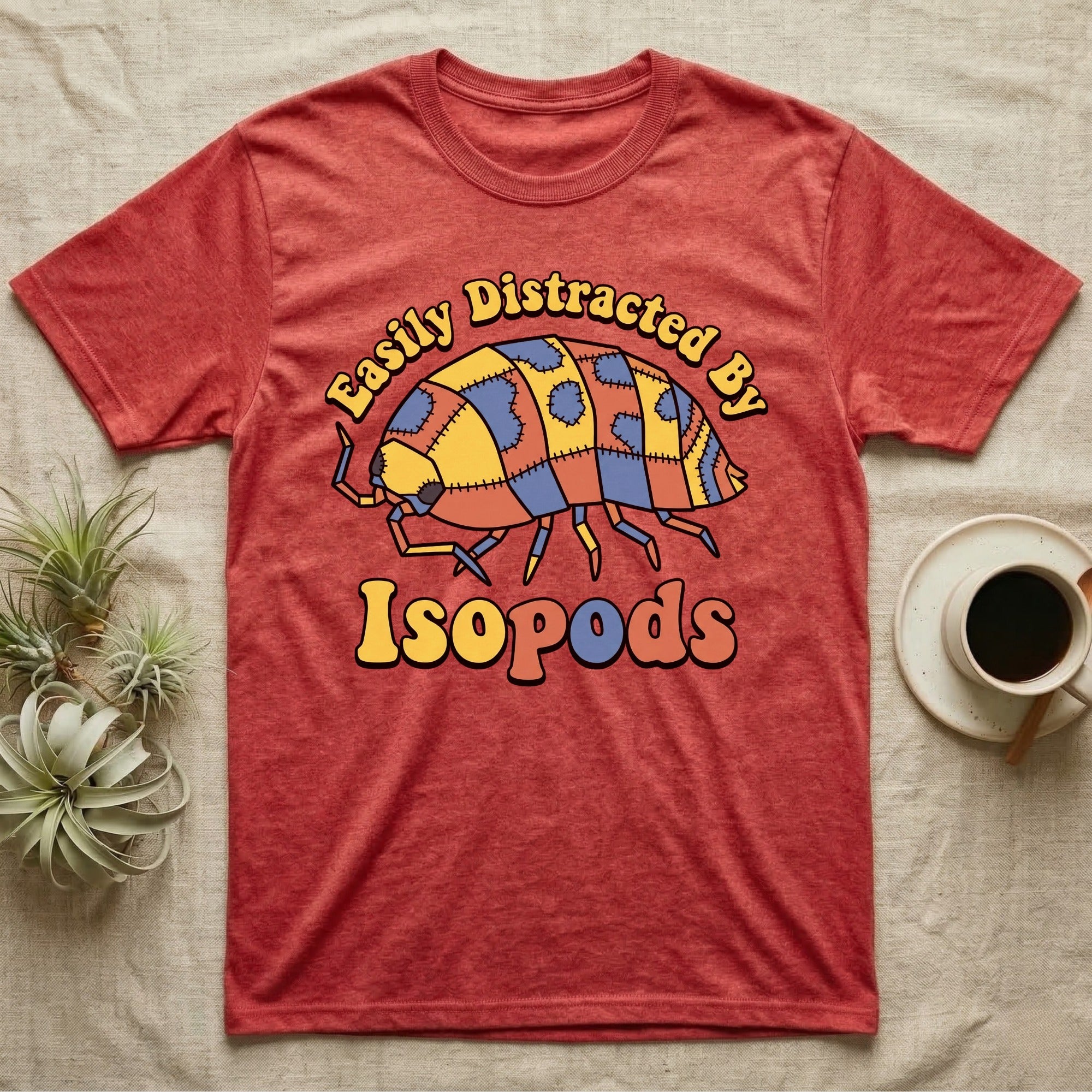 Dairy Cow Isopod Patchwork T-Shirt in Heather Red — Quilt-patchwork dairy cow isopod in mustard and denim under retro "Easily Distracted By Isopods" text.