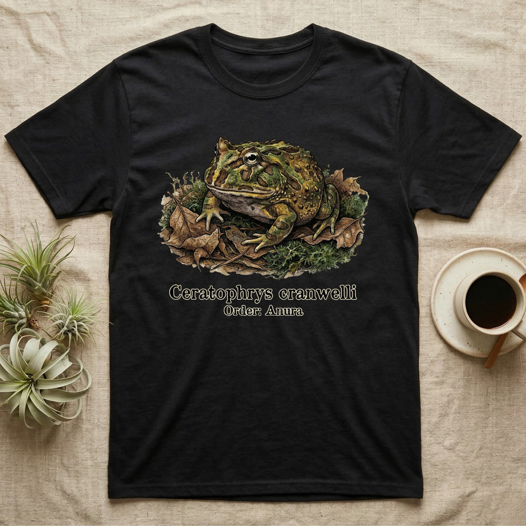 Black t-shirt featuring an illustration of a Ceratophrys cranwelli frog on leaves.