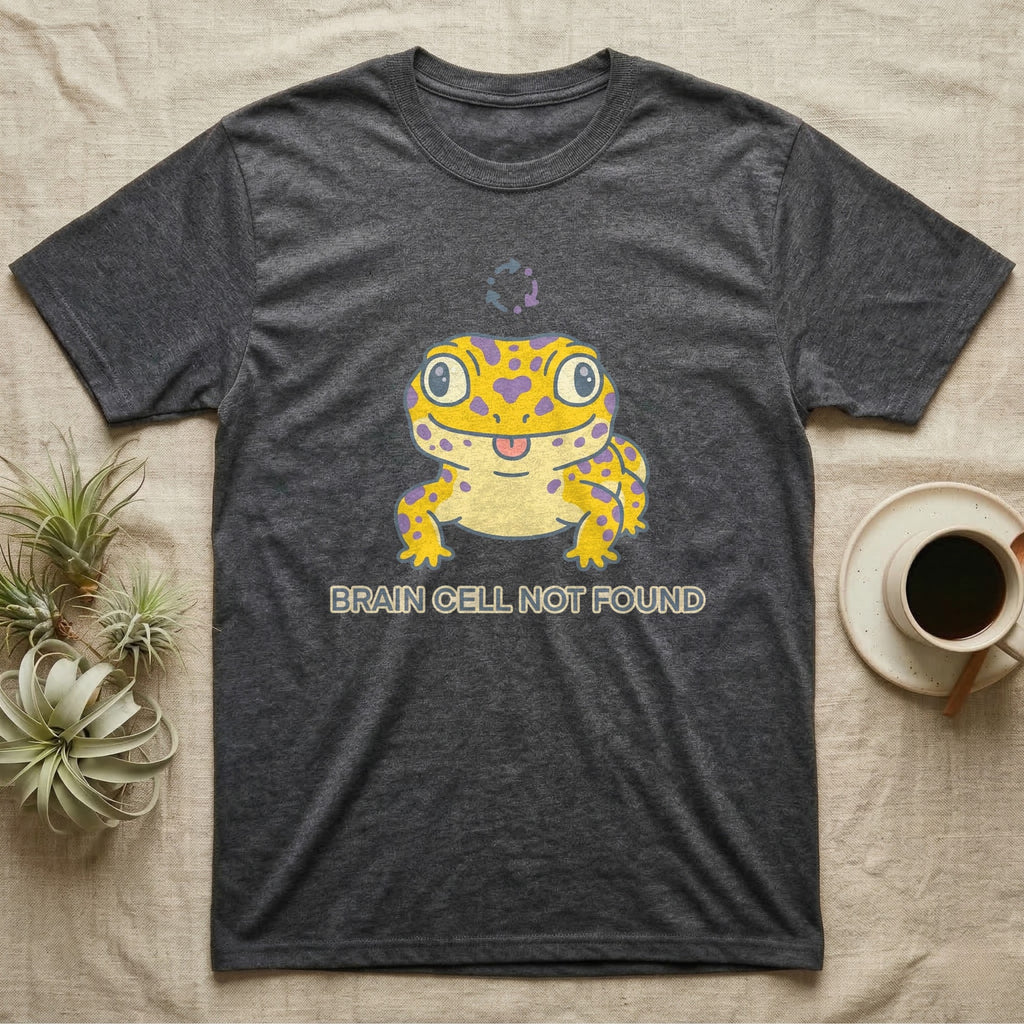 Dark grey t-shirt with a yellow gecko graphic that says "BRAIN CELL NOT FOUND".