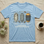 Isopod Substrate Sanitation Squad T-Shirt in Light Blue — Engraved chart of dairy cow, zebra and rubber ducky isopods labelled with their scientific names.