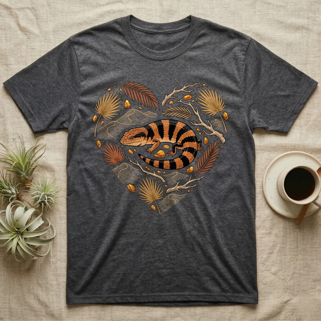 Dark grey t-shirt with a heart-shaped design featuring a striped lizard and foliage.