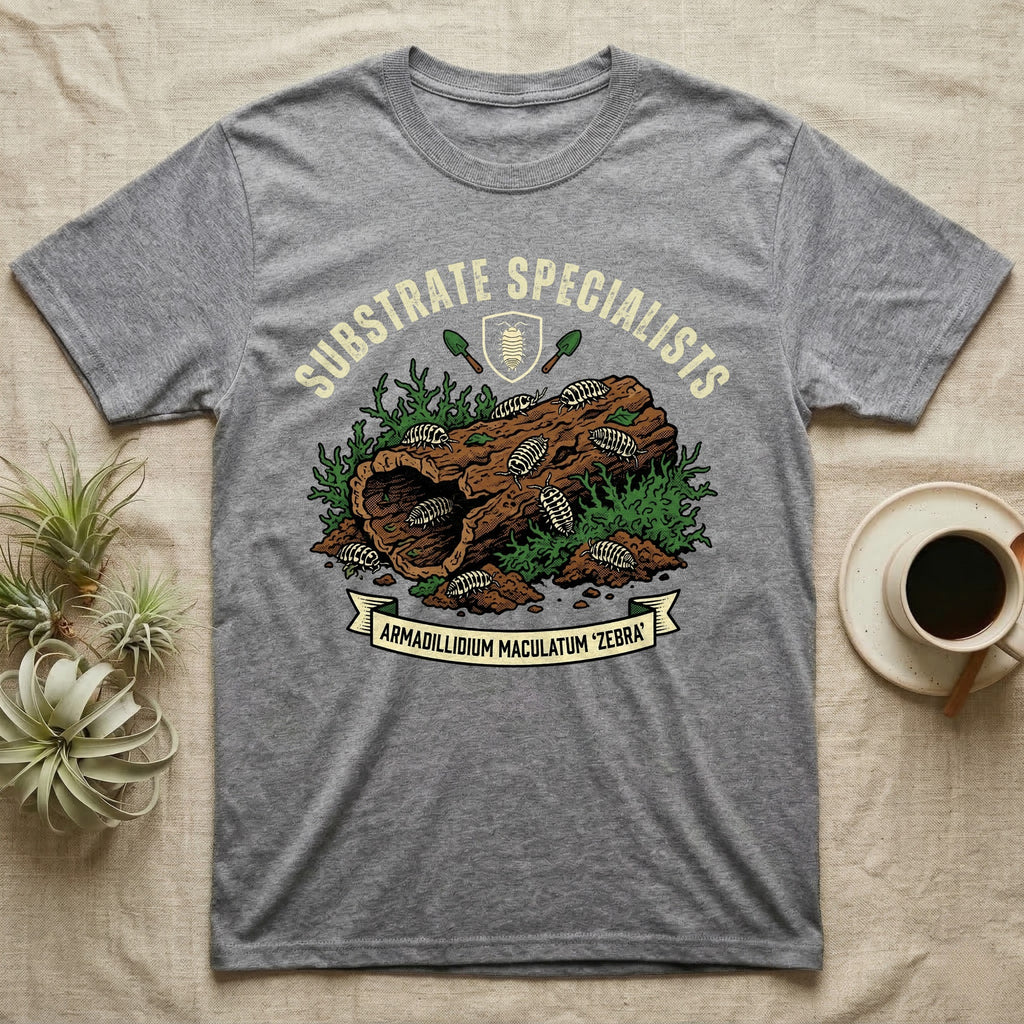 Zebra Isopod Substrate Specialists T-Shirt in Sport Grey — Vintage crest of zebra isopods on a mossy cork log with crossed trowels and Armadillidium ribbon.