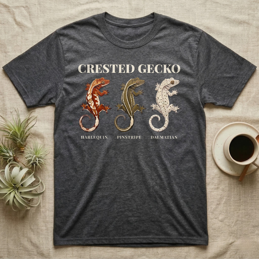 Crested Gecko Morph Chart T-Shirt in Dark Heather — Impasto painted chart of three crested gecko morphs — harlequin, pinstripe and dalmatian — labelled beneath each gecko.