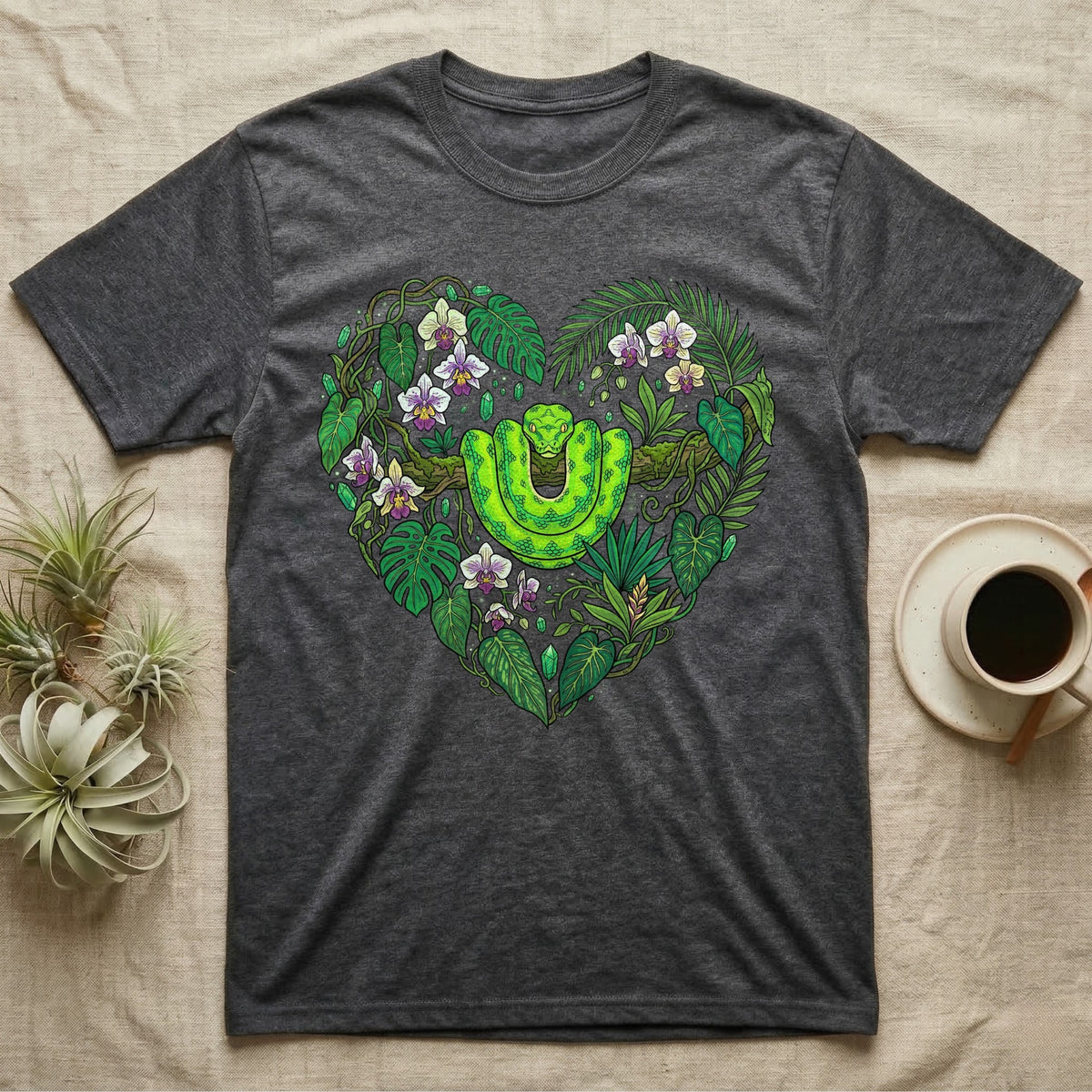 Dark gray t-shirt featuring a green snake in a heart-shaped floral design.