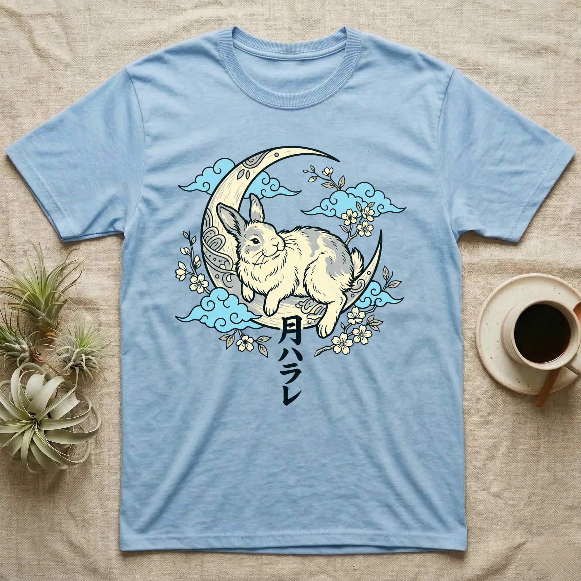 Light blue t-shirt with a Japanese moon rabbit and floral design.