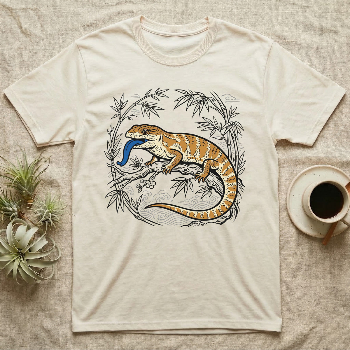 Bearded dragon on a branch with blue tongue, surrounded by bamboo.