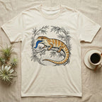 Bearded dragon on a branch with blue tongue, surrounded by bamboo.