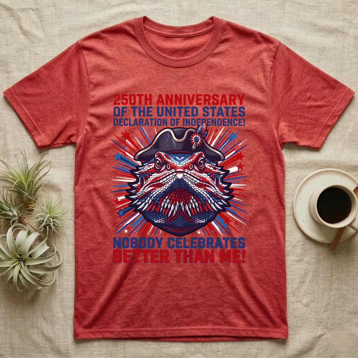 Bearded Dragon Fireworks T-Shirt in Heather Red — Pop-art bearded dragon head in a tricorn hat amid red-white-blue fireworks under Nobody Celebrates Better Than Me.