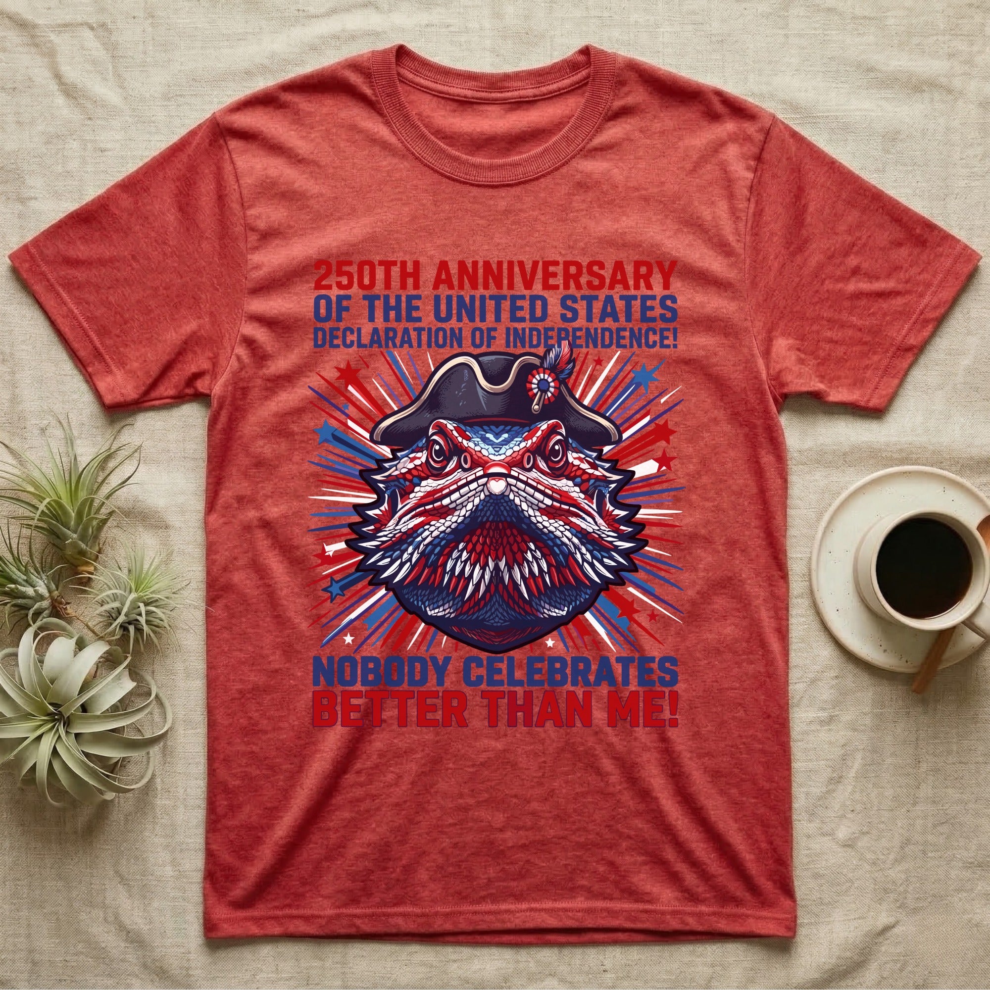 Bearded Dragon Fireworks T-Shirt in Heather Red — Pop-art bearded dragon head in a tricorn hat amid red-white-blue fireworks under Nobody Celebrates Better Than Me.