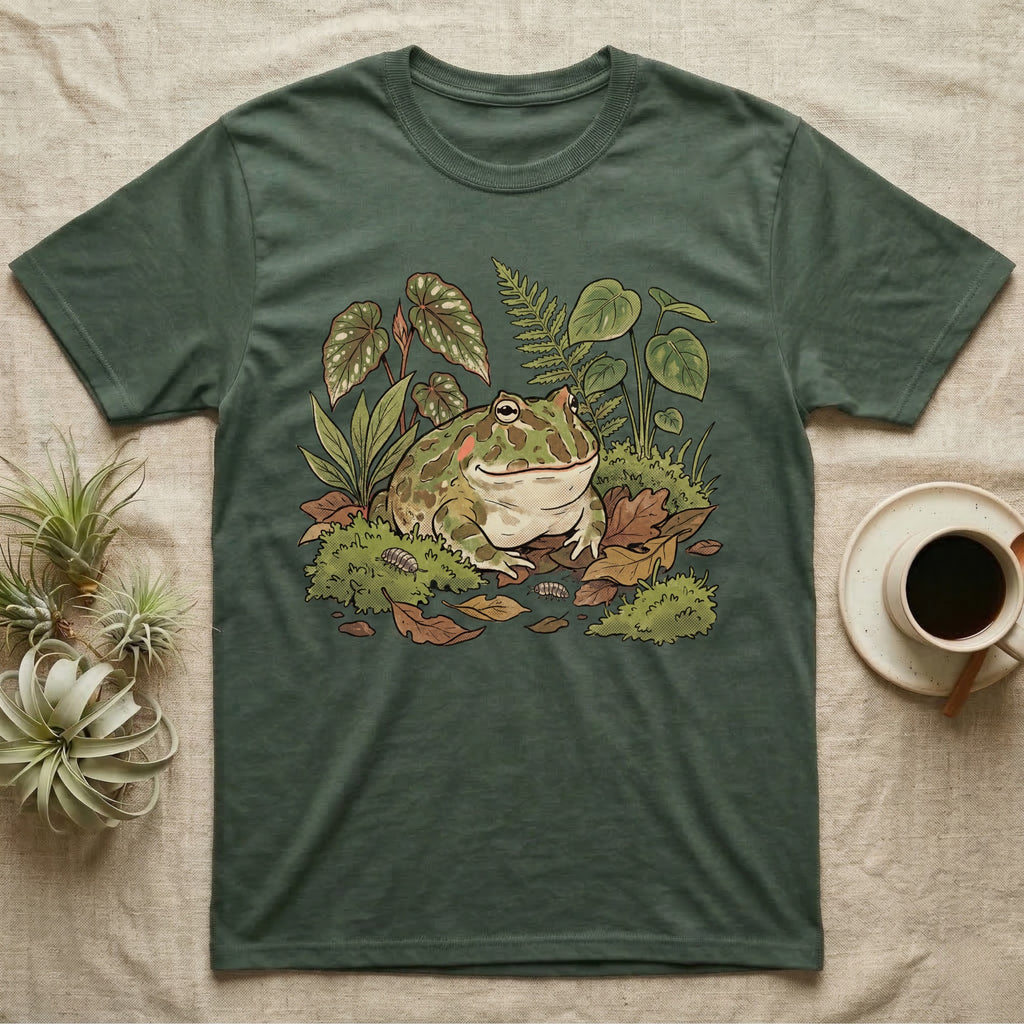 Bioactive Pacman Frog T-Shirt in Military Green — Warm botanical illustration of a content pacman frog half-buried in a lush bioactive habitat of moss and leaf litter.