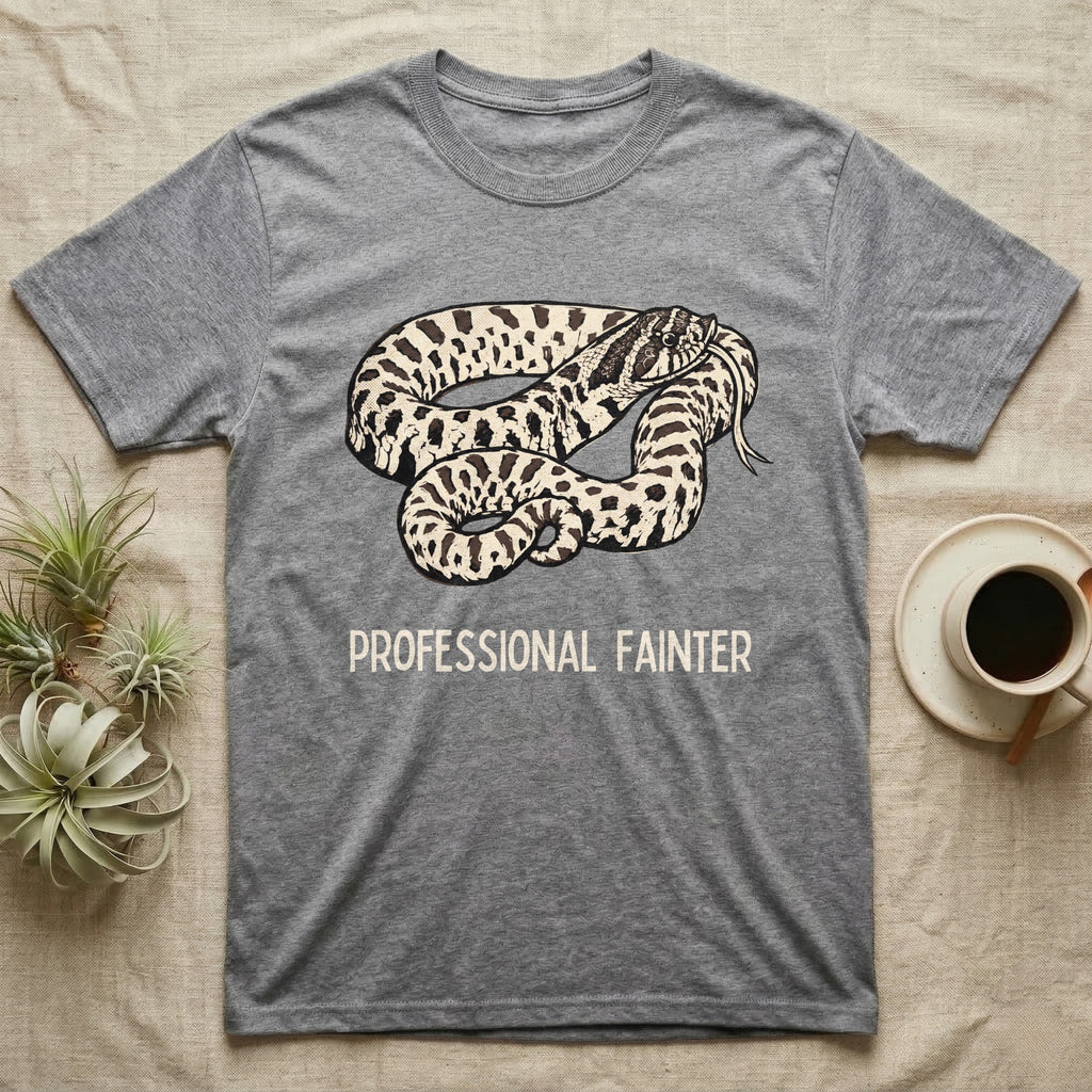Hognose Professional Fainter T-Shirt in Sport Grey — Linocut block-print of a western hognose snake flopped belly-up in a death-feign with professional fainter caption.
