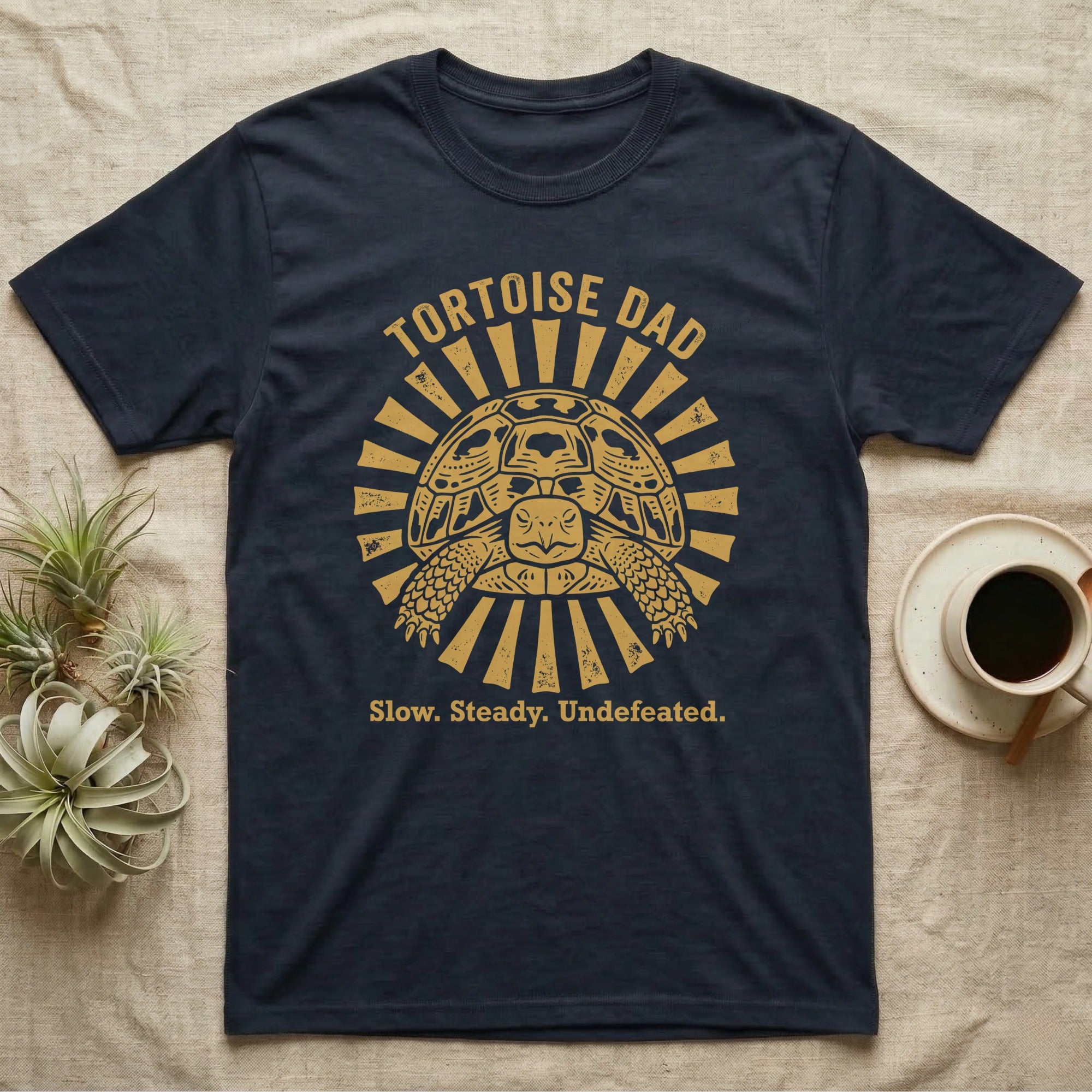 Hermann's Tortoise Dad T-Shirt in Navy — Folk woodblock sunburst badge of a Hermann's tortoise with arched "Tortoise Dad" lettering in ochre ink.