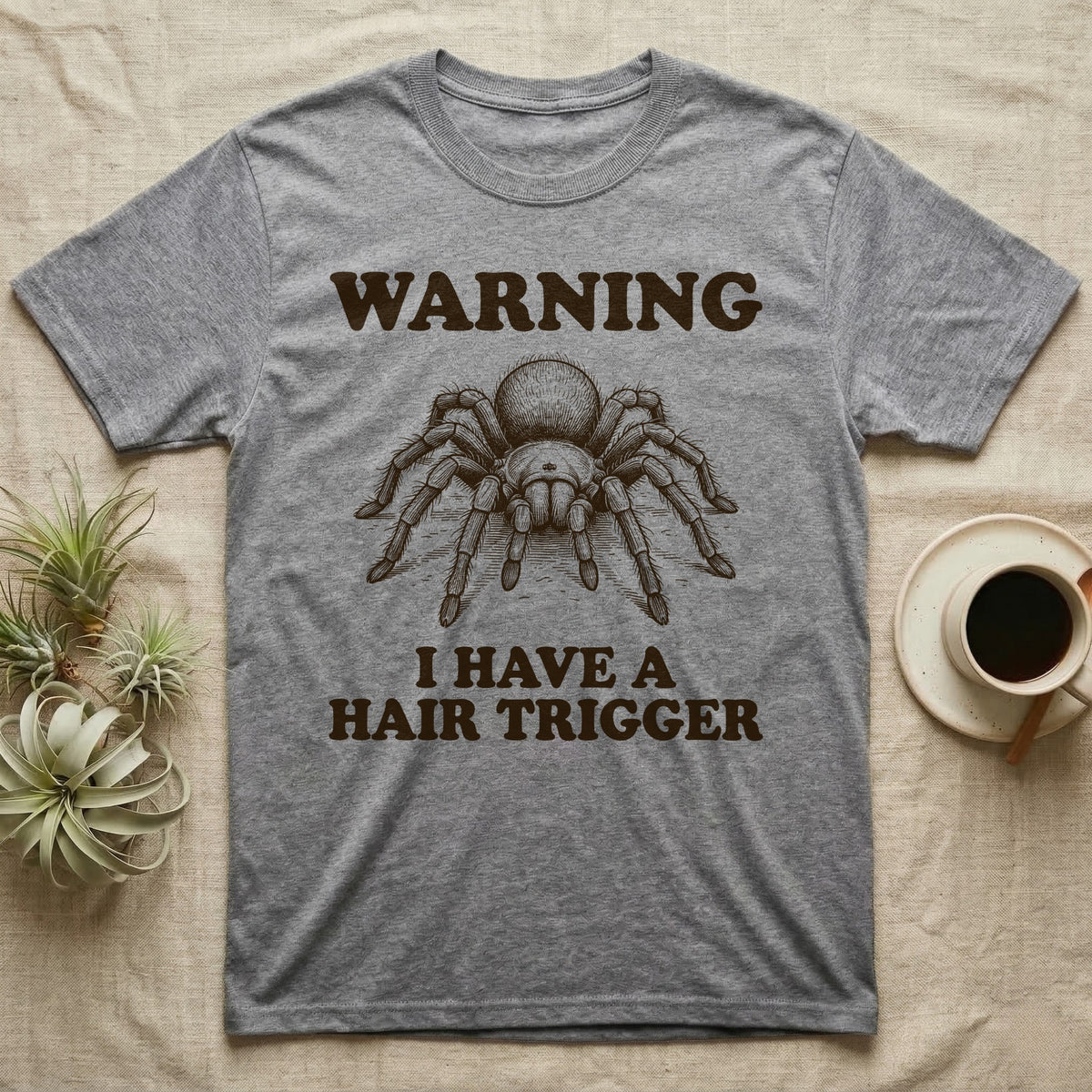 Tarantula Hair Trigger T-Shirt in Sport Grey — Engraved curly hair tarantula, front legs half-raised, with the words Warning, I Have a Hair Trigger